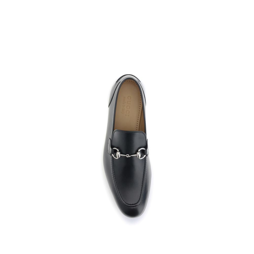 Gucci Black Calf Leather Bos Taurus Slip-On Loafers with metallic Morsetto detail, showcasing luxury craftsmanship for formal or casual wear.