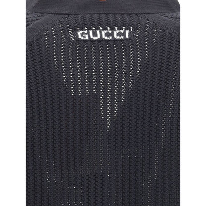 Close-up of Gucci Black Cotton Cardigan knit weave texture, showcasing elegant detail and logo on neck, perfect for a refined look.