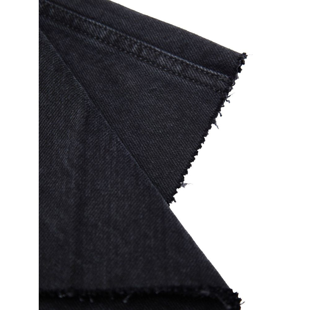 Close-up of Gucci Black Cotton Jeans Denim fabric showing texture and detailing.