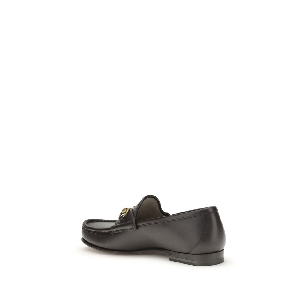Gucci Brown Calf Leather Bos Taurus Slip-On Loafers with Horsebit detail, showcasing elegant design and craftsmanship.