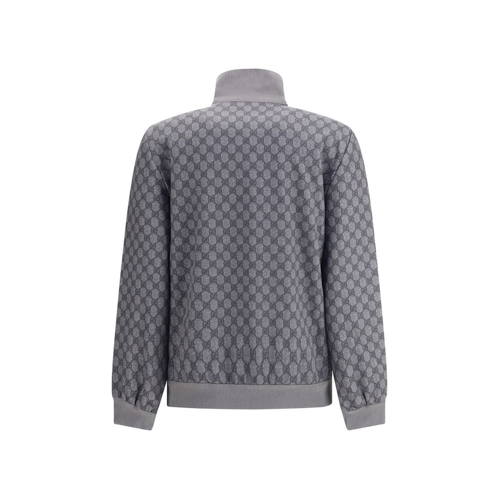 Back view of Gucci Gray Polyester Sweatshirt featuring GG motif and ribbed cuffs, showcasing a blend of sporty style and sophistication.