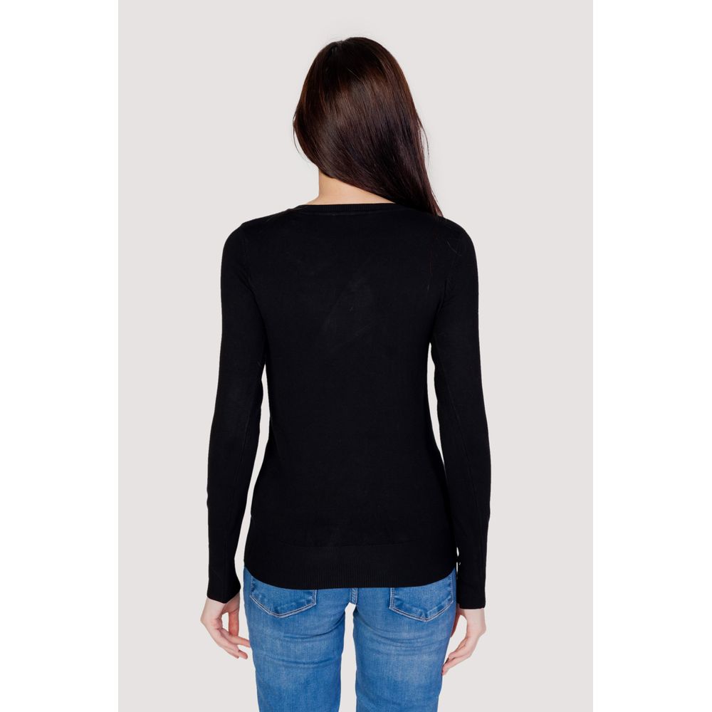 Back view of woman wearing Guess Black Cotton Sweatshirt, showcasing fitted silhouette and button sleeve details for a casual look.