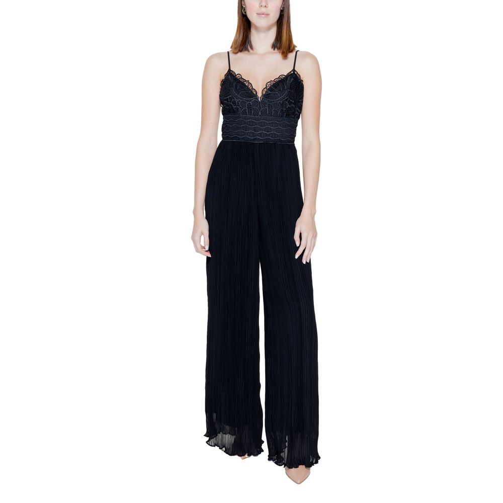 Woman wearing Guess Black Polyester Jumpsuit with lace bodice and pleated trousers, showcasing an elegant and contemporary style.