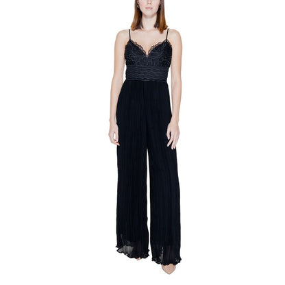 Woman wearing Guess Black Polyester Jumpsuit with lace bodice and pleated trousers, showcasing an elegant and contemporary style.