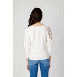 Back view of Guess White Viscose Sportswear sweater with batwing sleeves and logo detail on a woman wearing jeans.