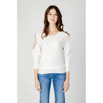 Guess White Viscose Sportswear, women's sweater with batwing sleeves and logo, model wearing white knitwear with jeans.
