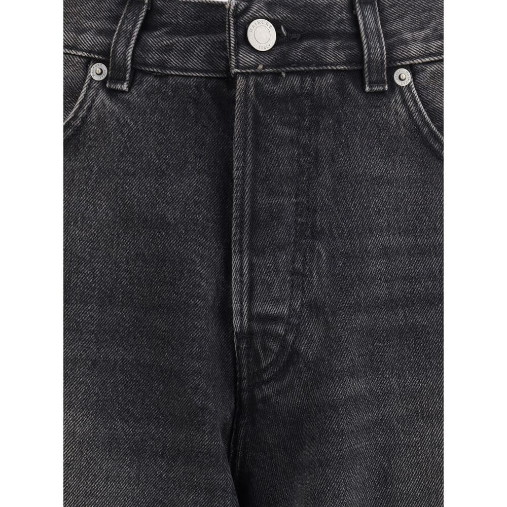Close-up of Haikure Black Cotton Relaxed Fit Jeans with buttoned front, belt loops, and quality stitching detail.