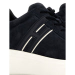 Hogan Pre Hogan H580 black/white leather sneakers with lace-up fastening and logo-embellished side, close-up view of round toe design.