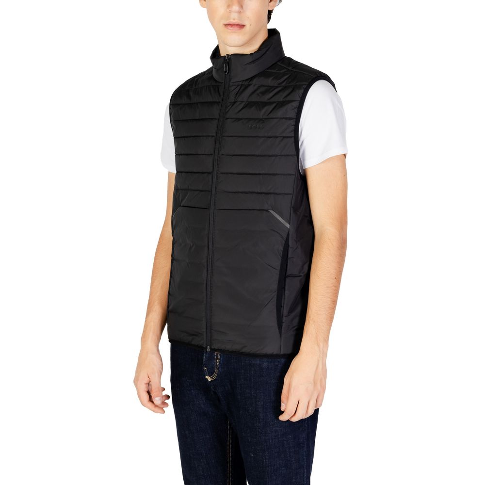 Man wearing Hugo Boss Black Polyester Sleeveless Jacket with quilted design, high collar, and front zip closure, offering modern style.