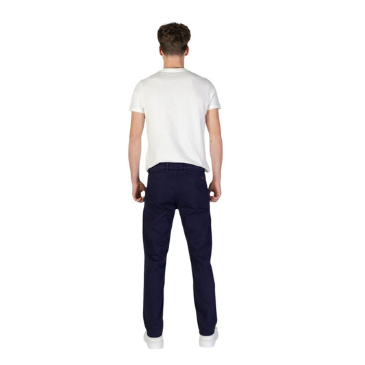 Rear view of model wearing Hugo Boss Blue Cotton Skinny Pant with white t-shirt, demonstrating slim fit design and contemporary style.
