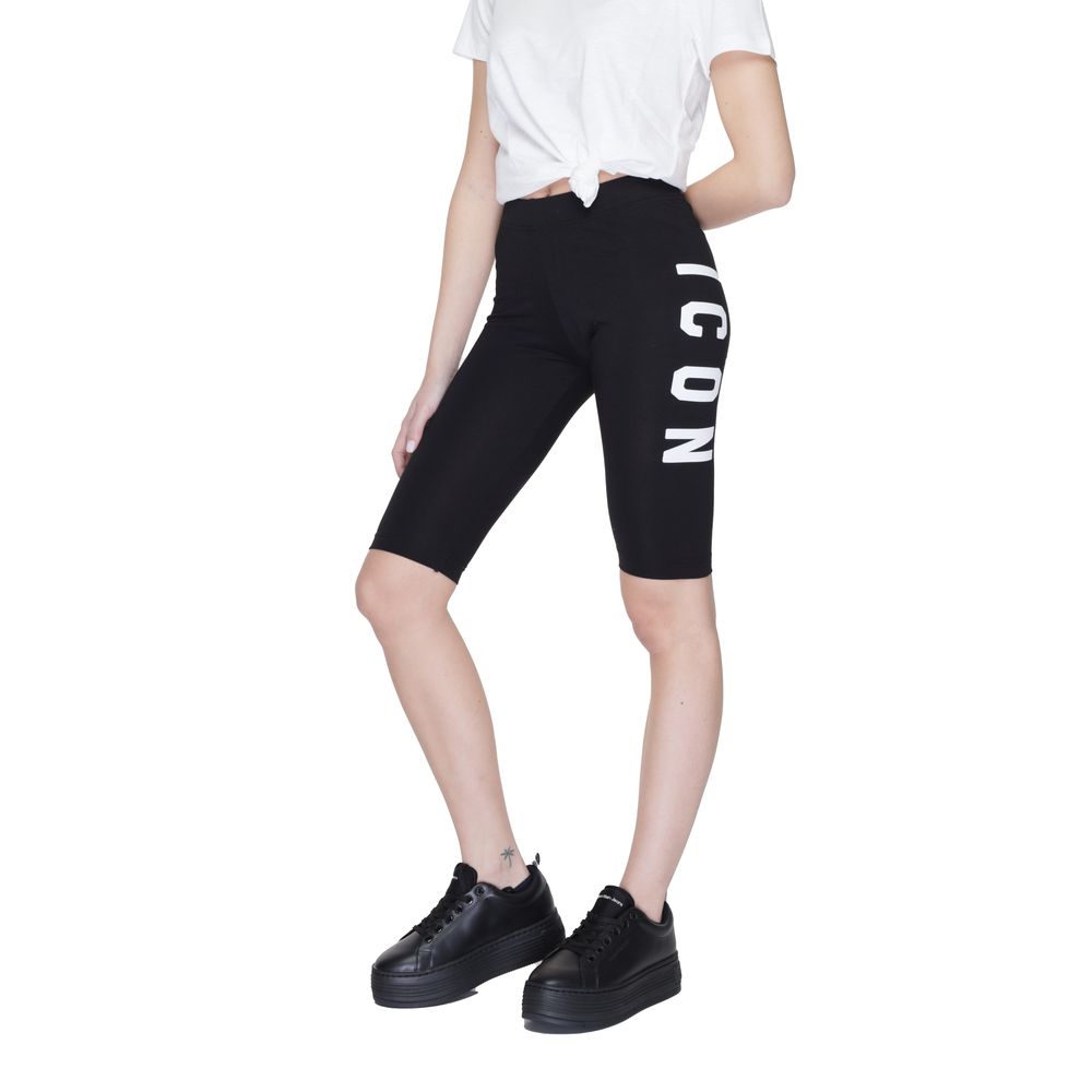 Woman wearing Icon Black Cotton Bermuda Shorts with ICON print, showcasing modern style and comfort, ideal for leisure and sports.
