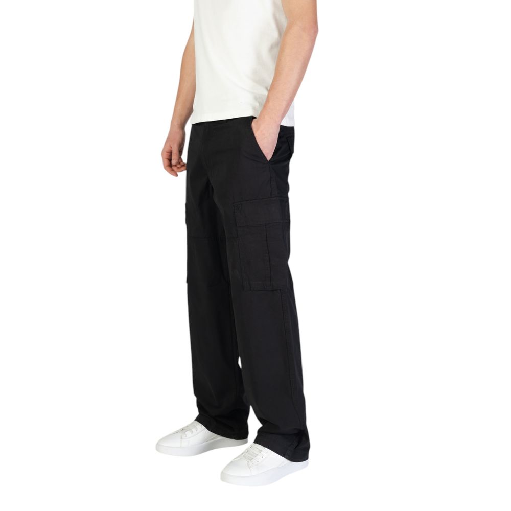 Model wearing Jack Jones Black Cotton Cargo Pants with side flap pockets and regular fit for comfort and style, perfect casual wear.