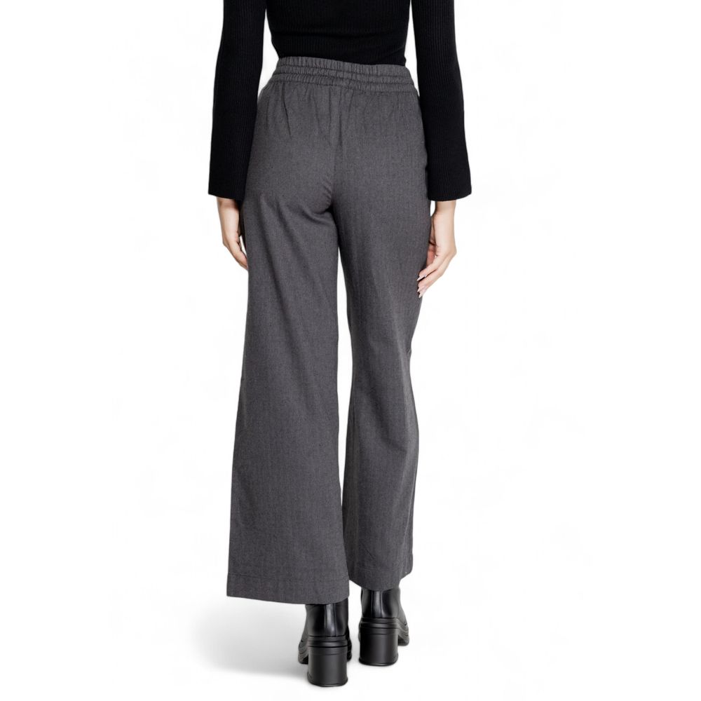 Back view of Jacqueline De Yong Gray Cotton Casual Pants on model, showcasing high-waisted palazzo cut and soft fabric blend.