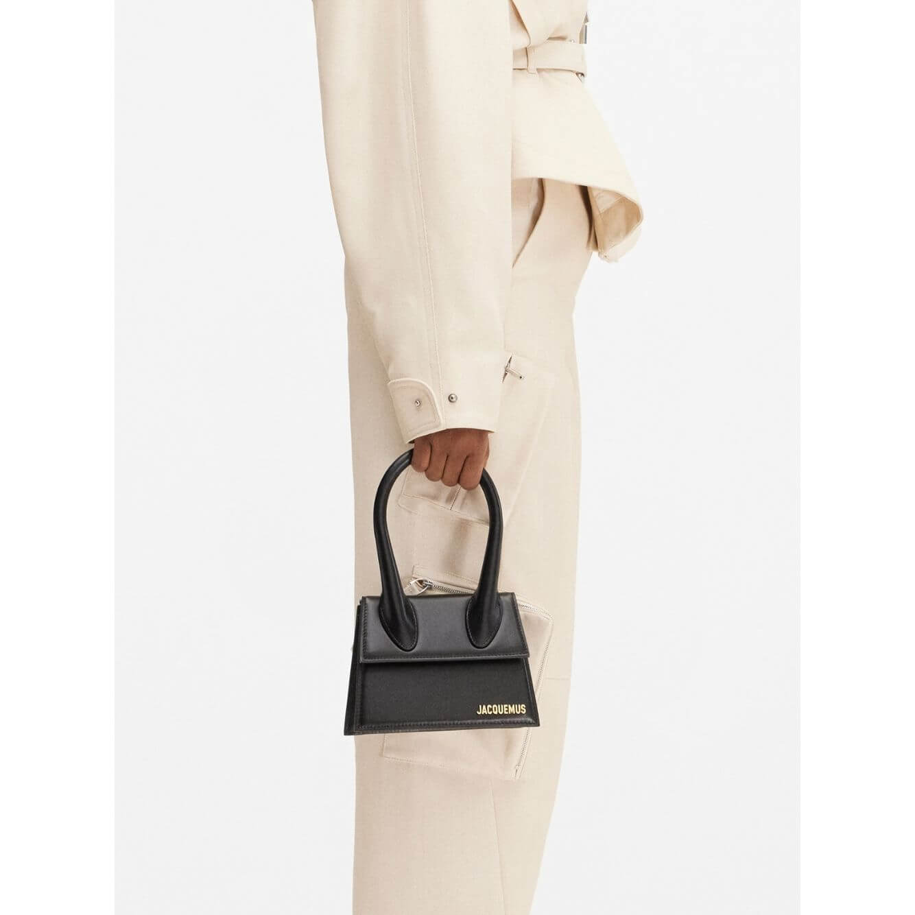 Jacquemus Le Chiquito Moyen Black Bag with gold hardware, model shown with reinforced handle and removable shoulder strap.
