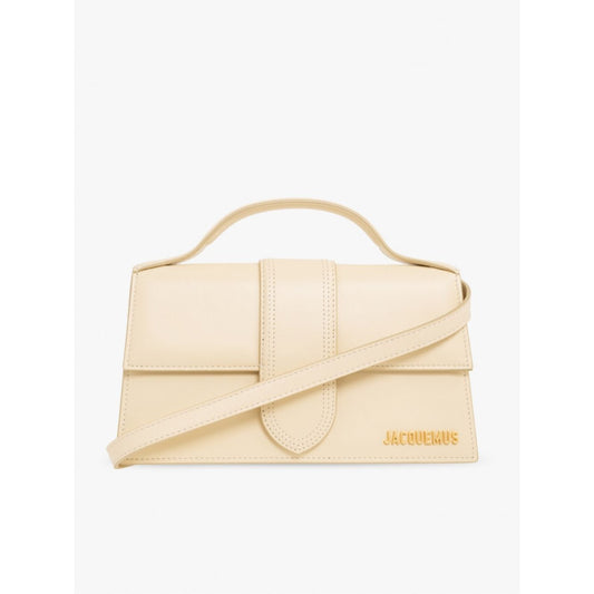 Jacquemus Le Grand Bambino Beige Bag with gold hardware, adjustable strap, and magnetic closure, featuring the Jacquemus logo.