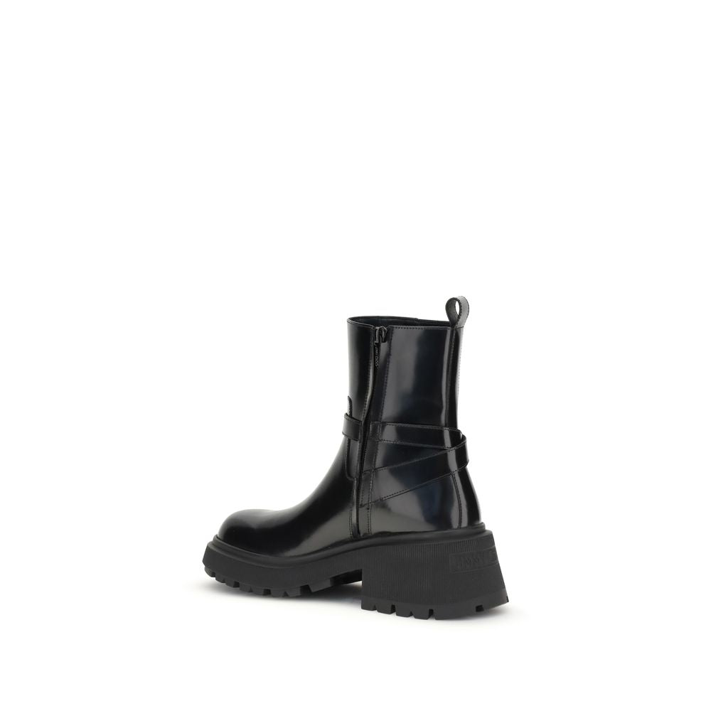 Jimmy Choo Black Calf Leather Bos Taurus Ankle Boots with patent leather finish, lugged sole, and adjustable buckle, side view.