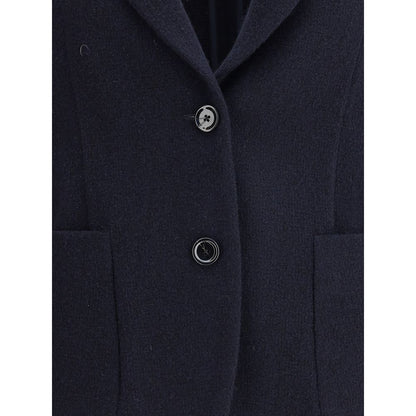 Close-up of Lardini Blue Wool Blazer with button closure and patch pockets, featuring the brand's signature flower-shaped pin.