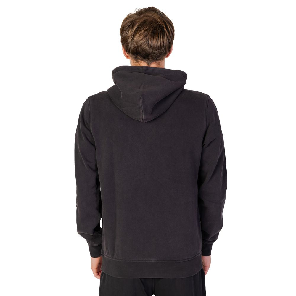 Back view of model wearing Liu Jo Black Cotton Hoodie showing adjustable hood and regular fit design.