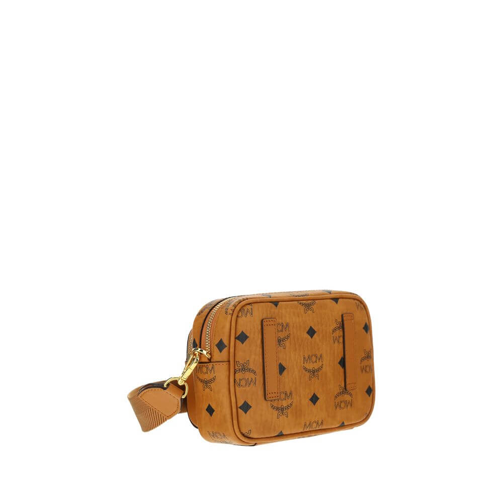 MCM Brown Cotton Shoulder Bag with monogram print, gold-tone details, adjustable strap, and top zipper closure for versatile use.