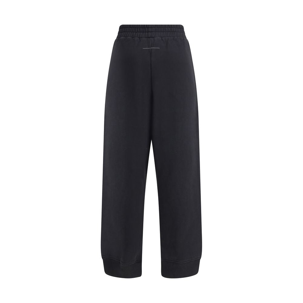 MM6 Black Cotton Joggers (Workout Pants) featuring elastic waistband, side pockets, and raw-cut slits for a modern look.