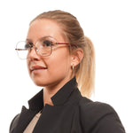 Woman wearing Max Mara Bronze Women Glasses Frame in metal and plastic, full-rim butterfly style with 55-16-140 size.