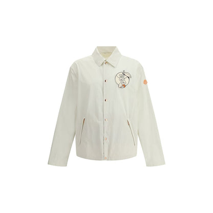 Moncler x Donald Glover White Cotton Coat with comic-style patches, part of the Moncler Genius line, featuring embroidered Moncler mascot.