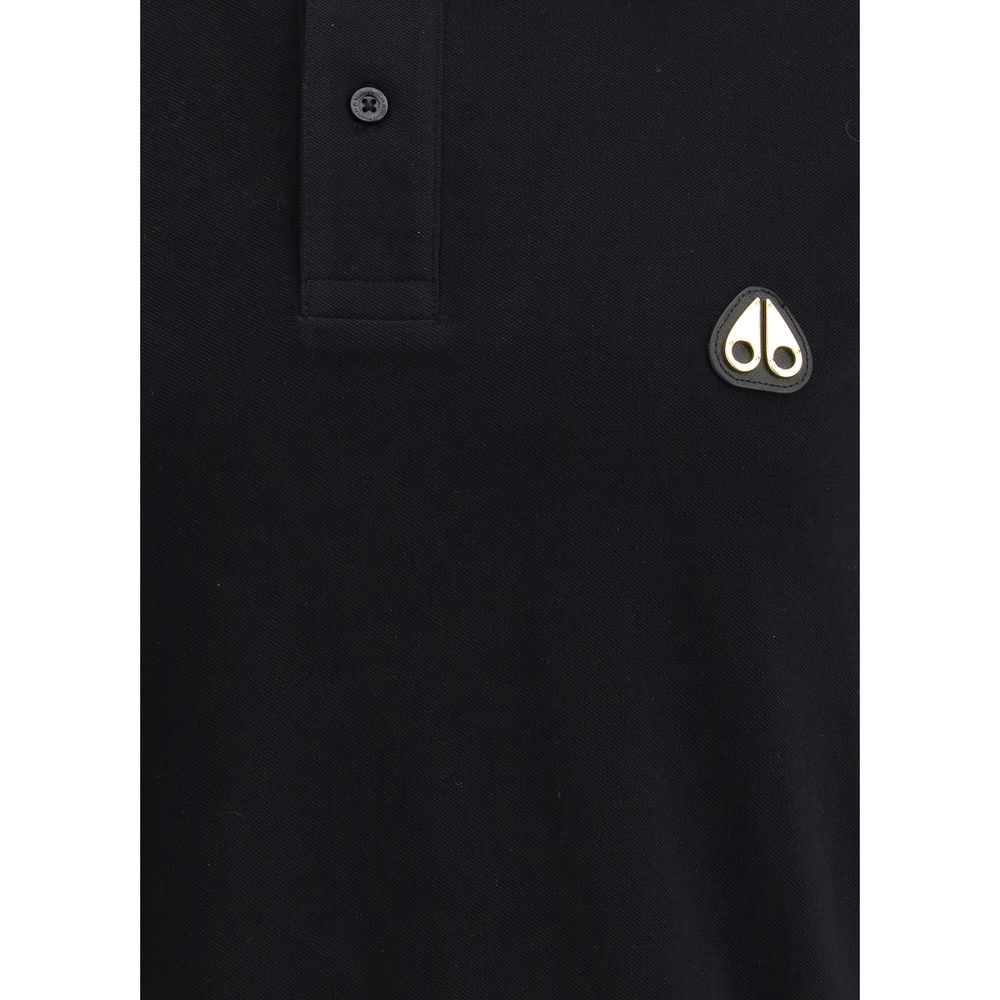 Moose Knuckles Black Cotton Polo Shirt with logo patch and buttons, ideal for versatile and stylish everyday wear.