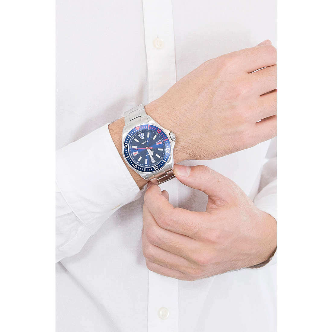 NAUTICA Mod. NAPCPS904 men's quartz watch with multifunction features, 46mm case, mineral dial, and silver bracelet on wrist.