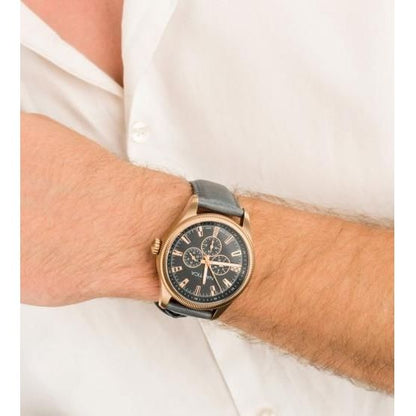 Gent wearing NAUTICA Mod. NAPSTB003 watch with quartz analog movement, 10 ATM water resistance, multifunction dial, in official box.