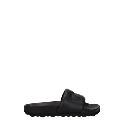 Off-White Black Leather Slippers with open toe and front logo, featuring low flat heel and rubber sole, MPN OWIT001LEA0011010.