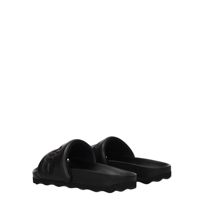 Off-White Black Leather Slippers featuring an open toe, low flat heel, and front logo design. Casual footwear ideal for everyday use.