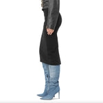 Woman wearing PINKO Black Viscose Skirt with rear zip and slit, paired with denim boots and a leather jacket, side view.