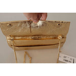 Interior view of Patrizia Pepe Gold Leather Embellished Shoulder Strap Bag with magnetic flap closure and brand tag.