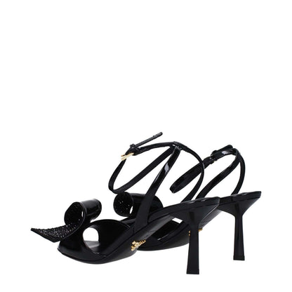 Prada Black Leather Stiletto Heel Sandals with open toe, buckle closure and mid heels, showcasing elegant black patent leather design.