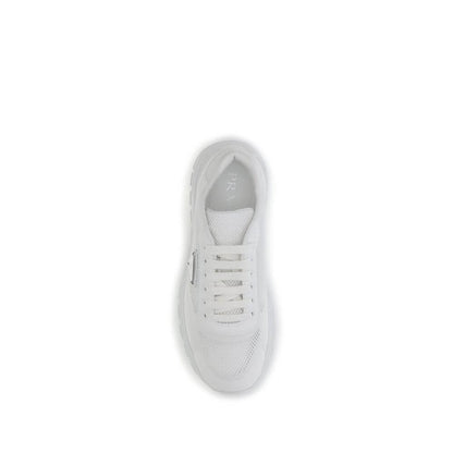 Top view of Prada White Rubber Athletic Sneakers featuring mesh design and enameled logo for urban style.
