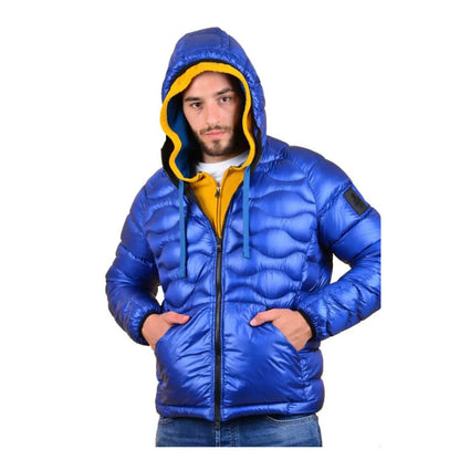 Man wearing Refrigiwear Blue Nylon Men Jacket with hood and zipper, showcasing durable down insulation for cold weather.