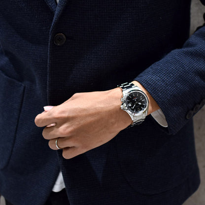 Man wearing SEIKO Mod. SPB117J1 wristwatch with stainless steel case and strap, featuring a sapphire dial, 20 ATM water resistance, and automatic movement.