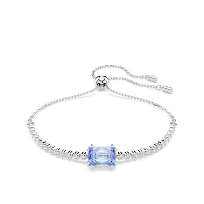 Elegant Swarovski bracelet with blue gemstone, delicate silver chain, adjustable clasp, perfect for stylish wear, gift option for women.
