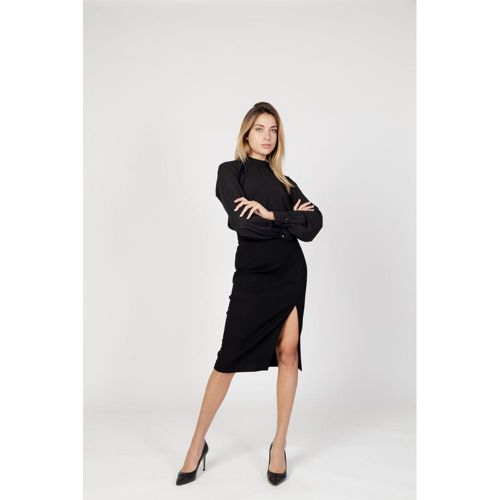 Model wearing Sandro Ferrone Black Polyester Blouse, featuring long sleeves and high neckline, paired with black skirt.