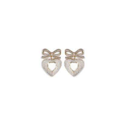 Self-Portrait Gold Brass Earrings with heart-shaped bows and silver crystal drops, elegant jewelry for stylish outfits.