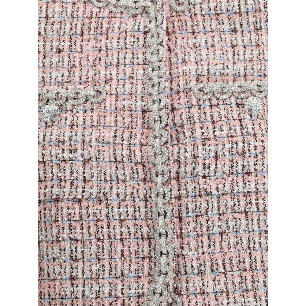 Close-up of Self-Portrait Multicolor Wool Coat showcasing the boucle fabric and rhinestone trim with faux fur cuffs for a chic look.