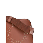 Close-up of Stella McCartney Faux leather Shoulder Bag featuring engraved monogram and adjustable strap for comfort and style, AW25 collection.