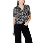 Street One Black Viscose Blouse with abstract pattern, short sleeves, and V-neck design on model, ideal for casual and evening wear.