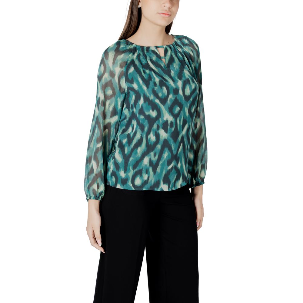 Woman wearing a Street One Green Polyester Blouse with a round neckline, perfect for casual or formal occasions.