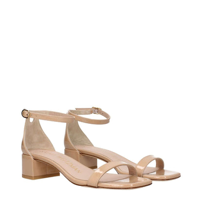 Stuart Weitzman Pink Leather Sandals with buckle closure, mid heel, and open toe design. Stylish casual footwear for any occasion.