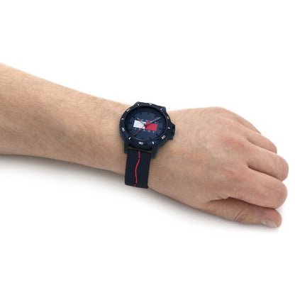 Gent's wrist wearing TOMMY HILFIGER Mod. 1791997 quartz analog multifunction watch with mineral dial and official packaging.