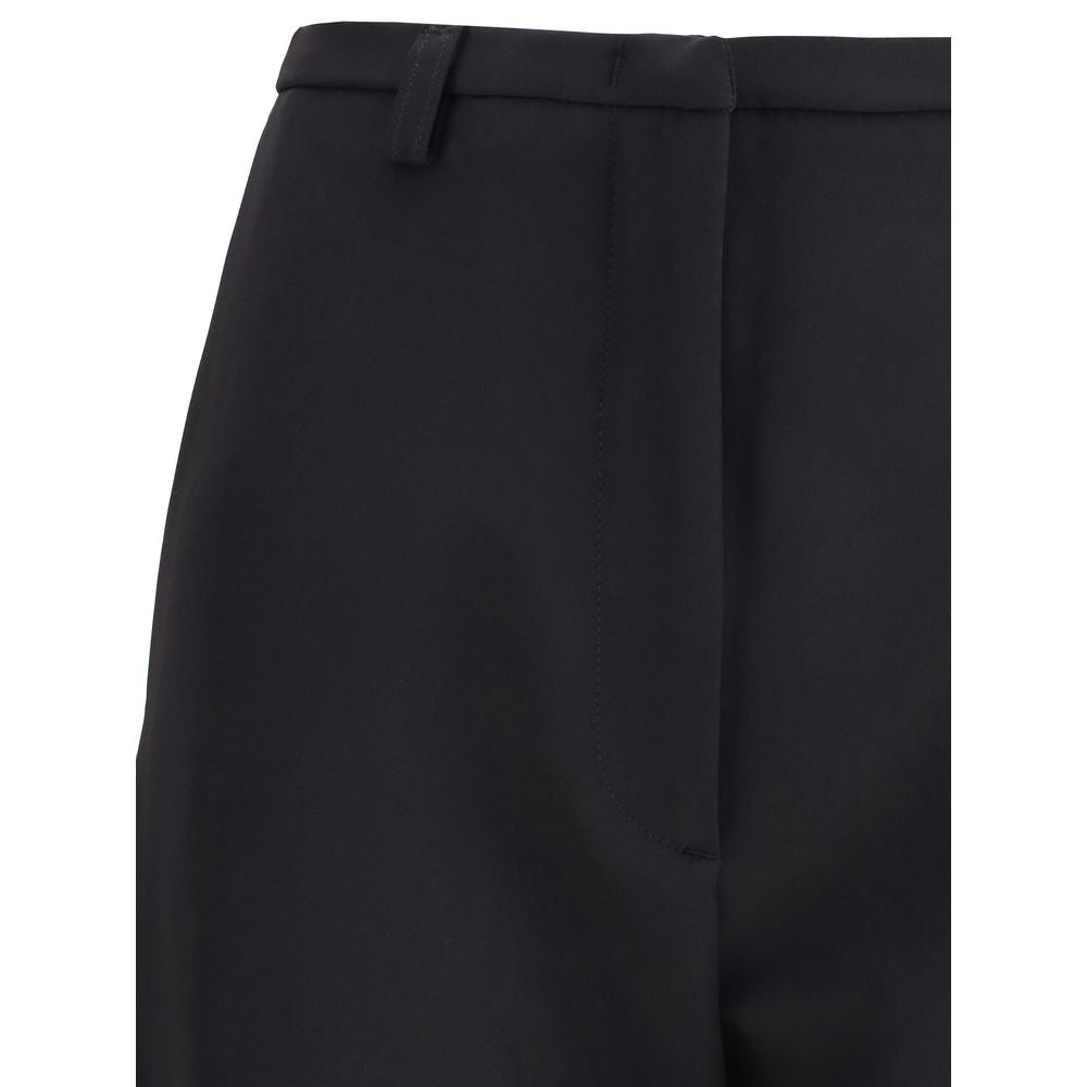 Close-up of The Latest Black Polyester Skinny Pants high-waisted design with zippered closure, highlighting the modern slit detail.