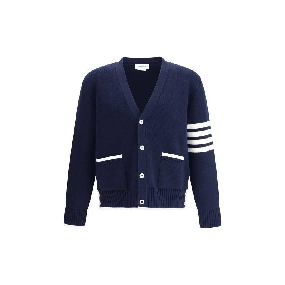 Thom Browne Blue Merino Wool Cardigan featuring V-neck, button closure, patch pockets, and striped sleeve detail.
