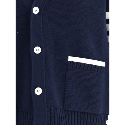 Close-up of Thom Browne Blue Merino Wool Cardigan with button details and patch pocket with contrasting piping.