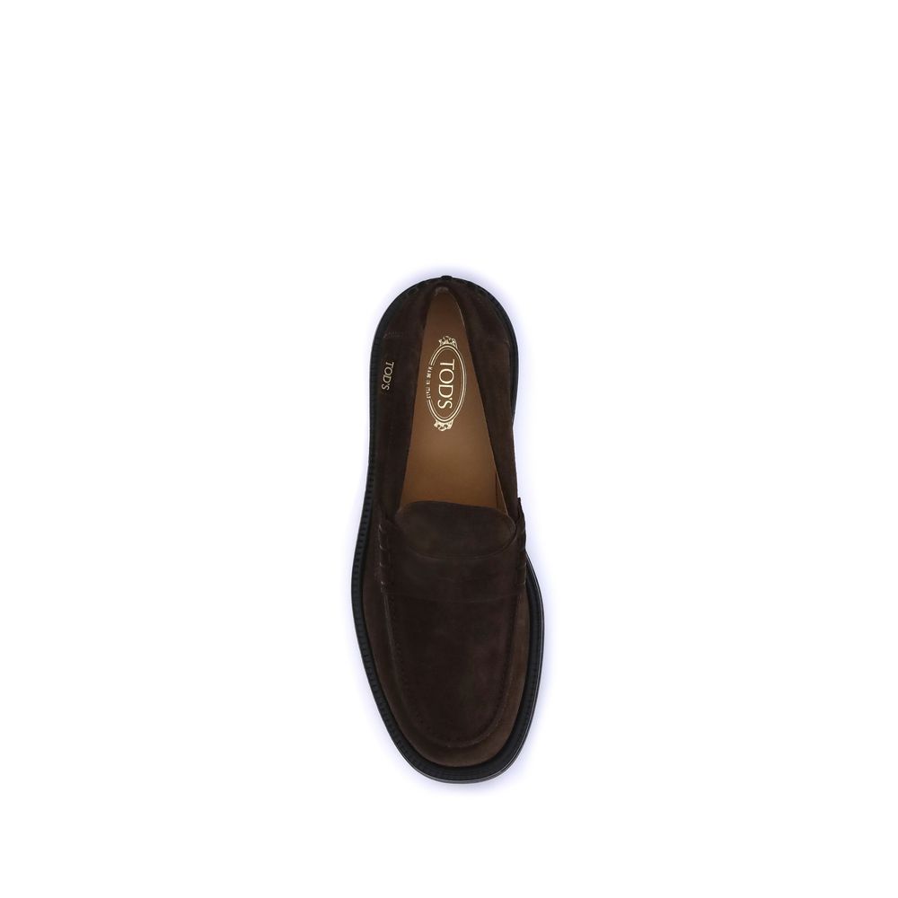 Top view of Tod's Brown Rubber Slip-On Loafers with hand-stitched detailing and Tod's logo, featuring rubber pebble detail for comfort.